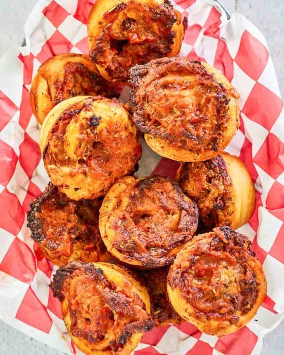 overhead view of homemade pizza rolls in a bread basket.