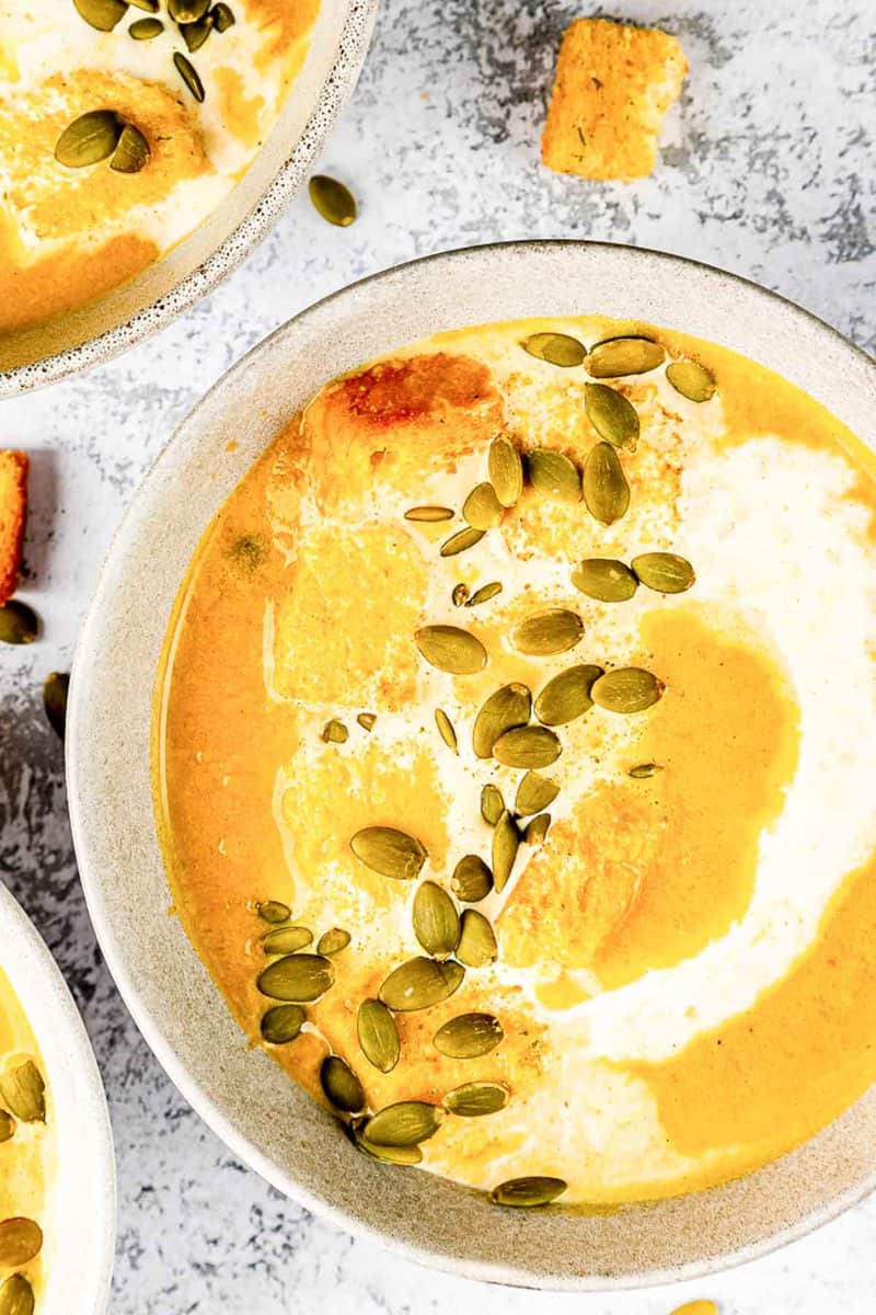 overhead view of a bowl of pumpkin bisque.