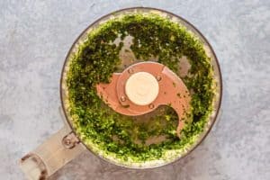 chopped herbs and garlic in a food processor.