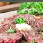 smoked steak with butter and parsley on top.