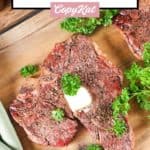 smoked steak and parsley on a cutting board.