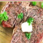 closeup of a smoked steak with a pat of butter on top.