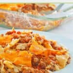 taco casserole serving on a blue plate.