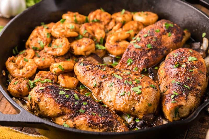 copycat Applebee's Bourbon Street chicken and shrimp in an iron skillet.