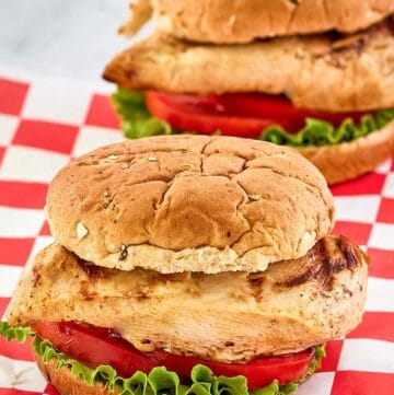 two copycat Chick Fil A grilled chicken sandwiches.
