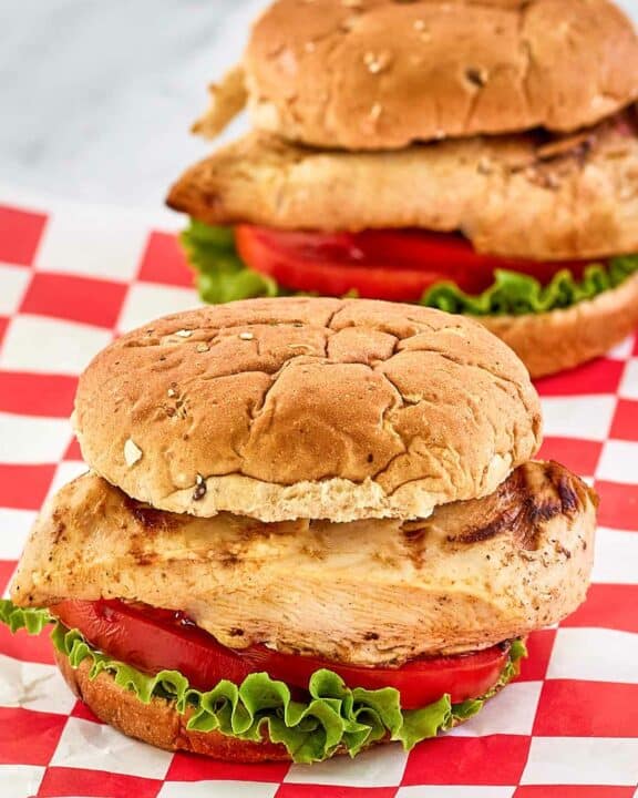 two copycat Chick Fil A grilled chicken sandwiches.