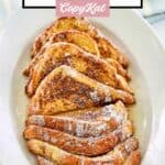 slices of homemade IHOP French Toast and syrup on a platter.