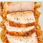 slices of Instant Pot pork loin on top of cooked onions.