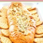 Mississippi sin dip and butter crackers on a platter.