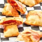 homemade pepperoni pizza hot pockets scattered on parchment paper.
