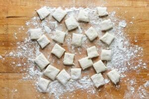 pizza dough cut into small pieces.