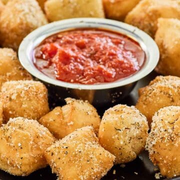 copycat Rosati's dough nuggets with a small bowl of marinara sauce.