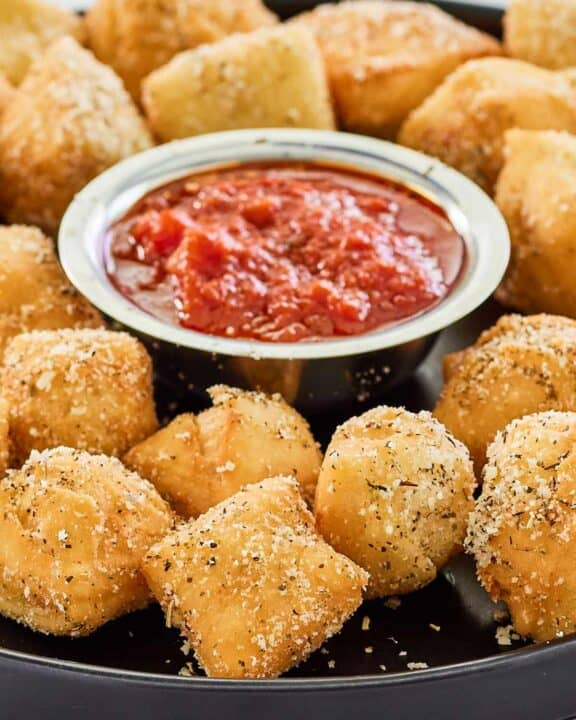 copycat Rosati's dough nuggets with a small bowl of marinara sauce.