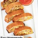 sliced homemade sausage roll on a platter.