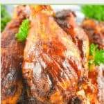 several smoked barbecue chicken drumsticks.