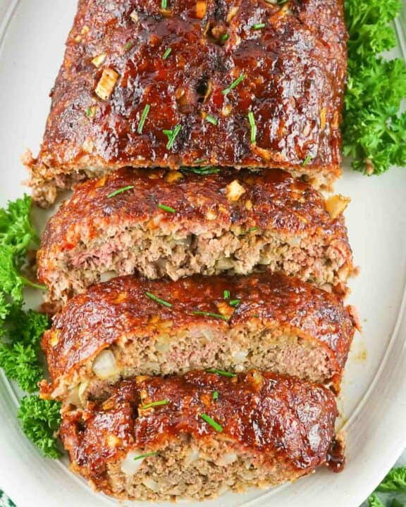 overhead view of smoked meatloaf on a platter.
