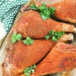 overhead view of four homemade smoked turkey legs.