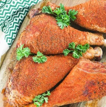 overhead view of four homemade smoked turkey legs.