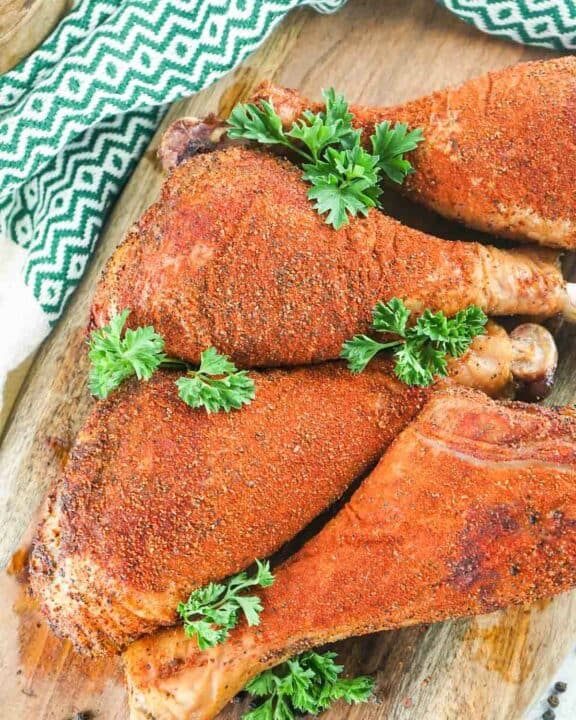 overhead view of four homemade smoked turkey legs.