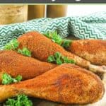 homemade smoked turkey legs and parsley on a wood serving board.