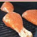 turkey legs on a smoker rack.