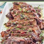 sliced stove top pot roast on a rectangular platter.
