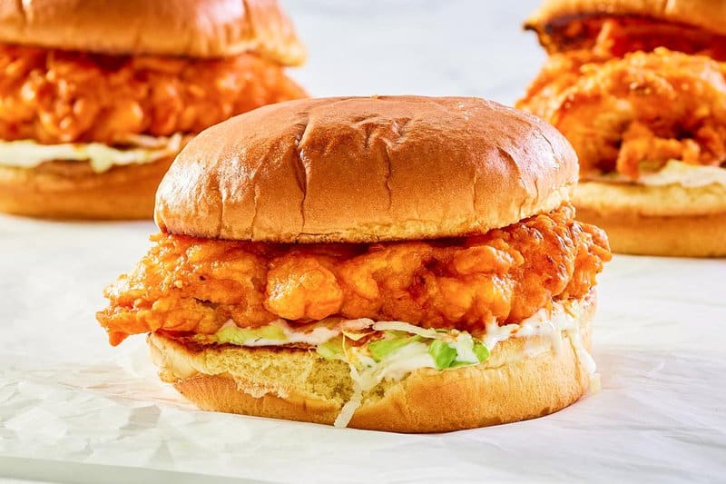 copycat Arby's buffalo chicken sandwich on parchment paper.