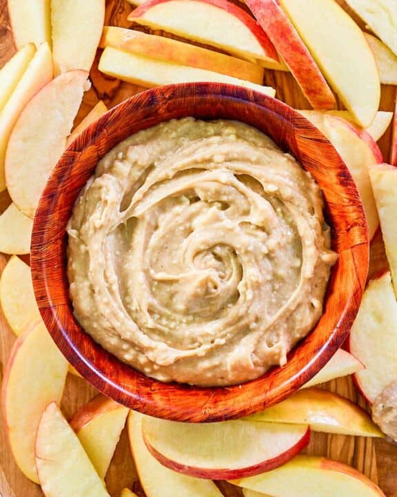 overhead view of caramel apple dip and apple slices around it.