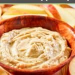 bowl of caramel apple dip and apple slices by it.
