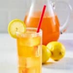 a glass of homemade Chick Fil A sunjoy and lemons.