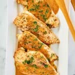 overhead view of chicken dijon and sauce on a platter.
