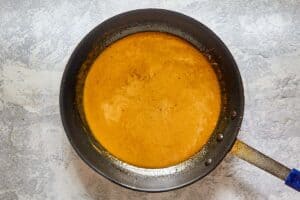 chicken dijon sauce in a pan.