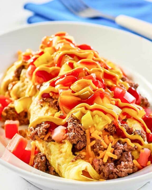 copycat IHOP cheeseburger omelette on a white plate.