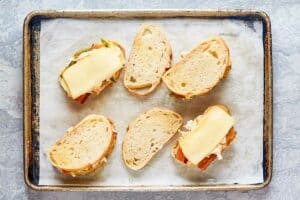 jalapeno popper grilled cheese sandwiches before cooking them.