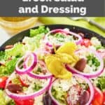 homemade Panera Greek salad and dressing behind it.