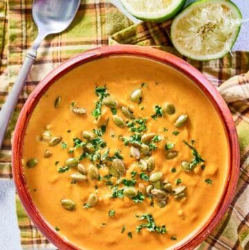 overhead view of pumpkin curry soup in a bowl.