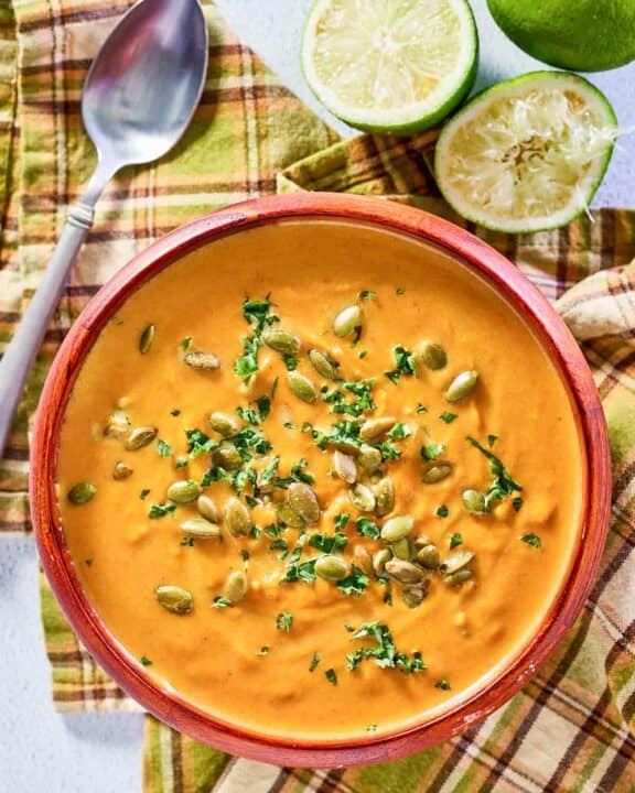 overhead view of pumpkin curry soup in a bowl.