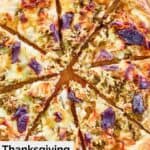overhead view of Thanksgiving pizza cut into slices.