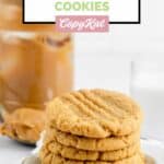 5 homemade peanut butter cookies and a jar of peanut butter.
