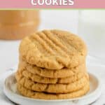 5 homemade peanut butter cookies stacked on a small plate.