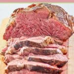beef tenderloin roast on a wood cutting board.