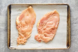 two chicken breasts pounded thin into cutlets.