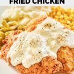 closeup of homemade Cracker Barrel chicken fried chicken, gravy, and vegetables.