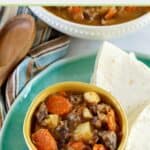homemade cane guisada and flour tortillas on a plate.
