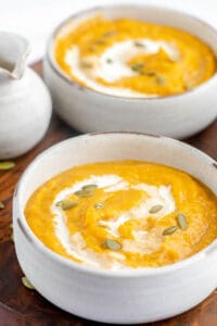 two bowls of copycat Panera autumn squash soup.