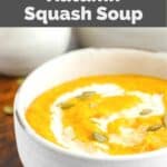 bowl of homemade Panera Bread autumn squash soup garnished with pepitas.