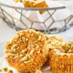 copycat Starbucks pumpkin cream cheese muffins on a plate and in a basket.