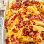 homemade Wendy's baconator fries on a platter.