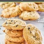 white chocolate cranberry cookies on parchment paper and wire rack.