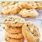 five white chocolate cranberry cookies on parchment paper.